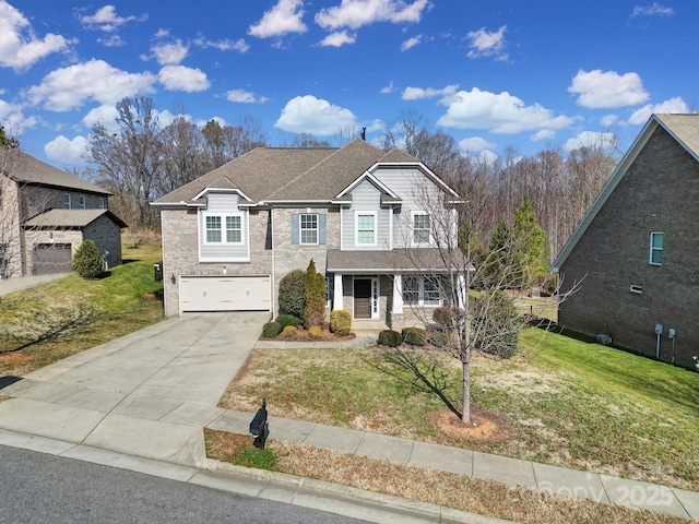 front of property featuring a garage, a front yard, and covered porch