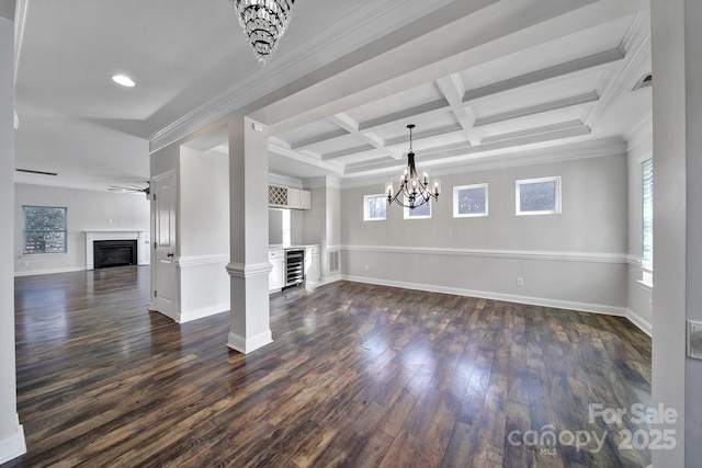 unfurnished living room with dark wood-type flooring, coffered ceiling, ornamental molding, beamed ceiling, and beverage cooler