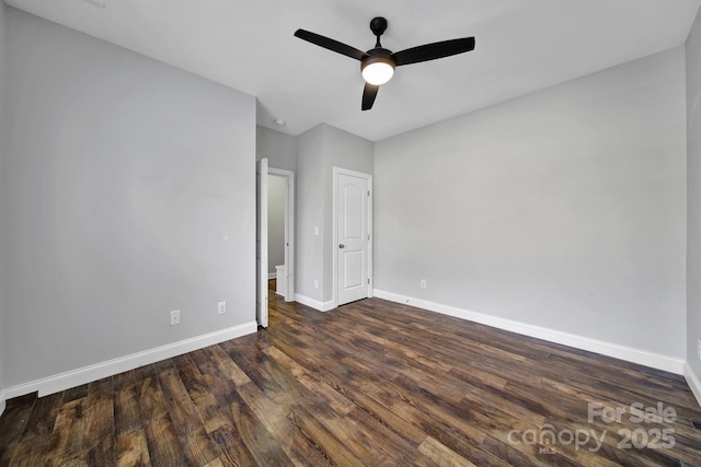 unfurnished bedroom featuring dark wood-type flooring and ceiling fan