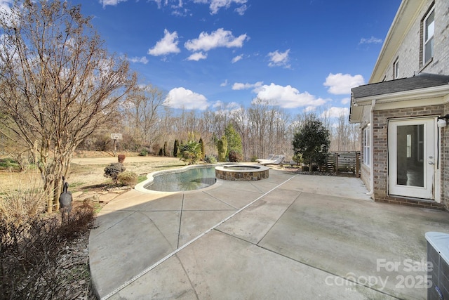 view of patio featuring a pool with hot tub and central air condition unit