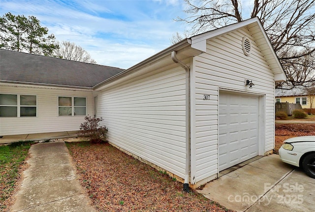 view of property exterior featuring a garage