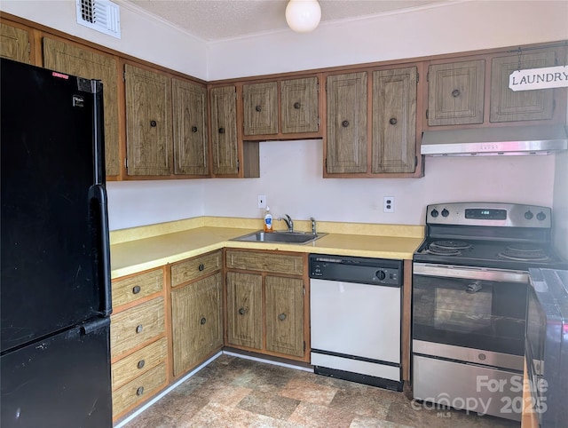 kitchen with dishwasher, sink, black fridge, a textured ceiling, and electric stove