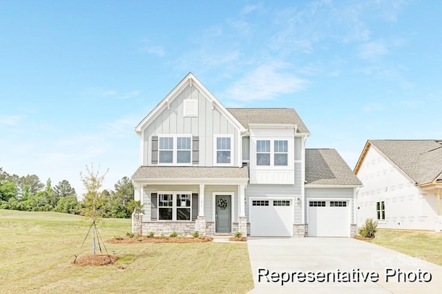 view of front of property with a garage and a front lawn