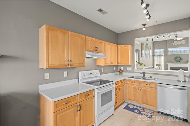 kitchen featuring sink, light hardwood / wood-style floors, dishwasher, and white range with electric cooktop