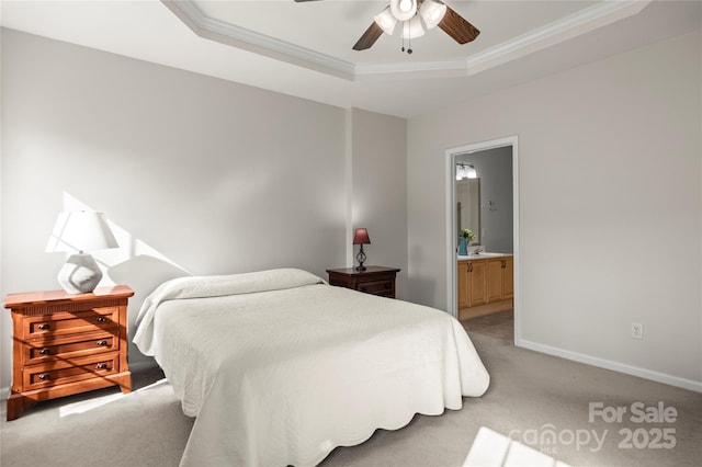 bedroom with crown molding, ceiling fan, ensuite bathroom, carpet, and a raised ceiling