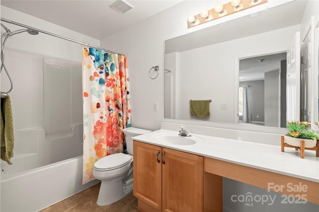 full bathroom featuring shower / bathtub combination with curtain, vanity, tile patterned flooring, and toilet