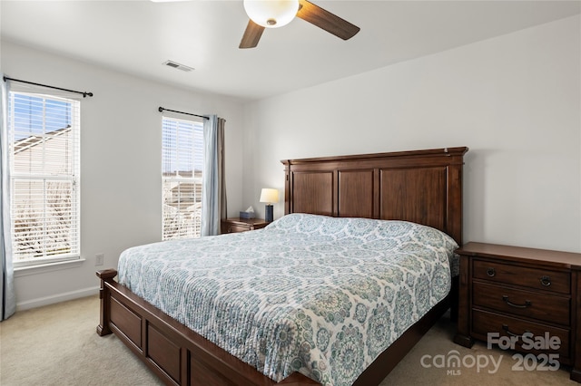 carpeted bedroom with ceiling fan