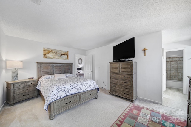 carpeted bedroom featuring a textured ceiling