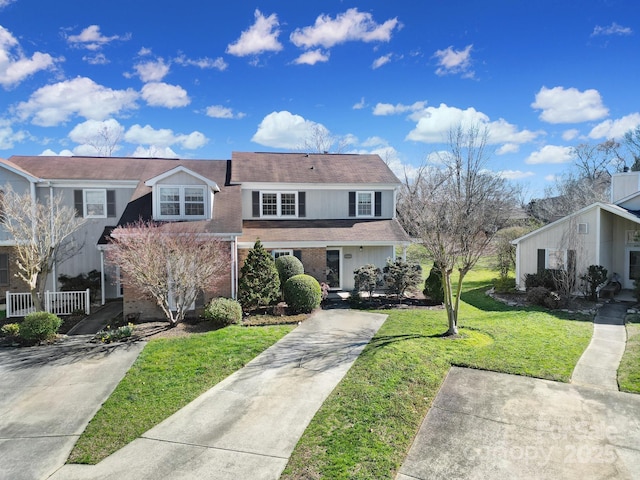 front facade with a front lawn