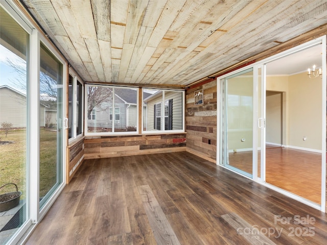 449 Riverwind Dr, Hendersonville, NC 28739 - unfurnished sunroom with a wealth of natural light, wood finished floors, wooden ceiling, and a chandelier