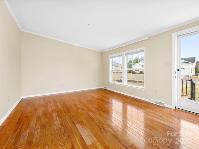 449 Riverwind Dr, Hendersonville, NC 28739 - unfurnished room featuring baseboards, visible vents, crown molding, and light wood-style floors