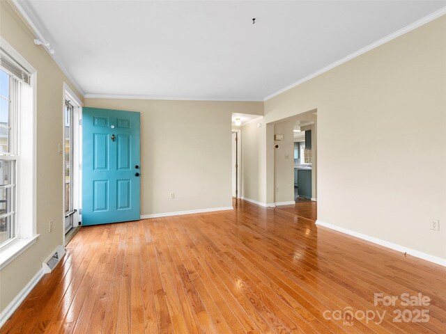 449 Riverwind Dr, Hendersonville, NC 28739 - interior space with light wood-type flooring, crown molding, baseboards, and visible vents