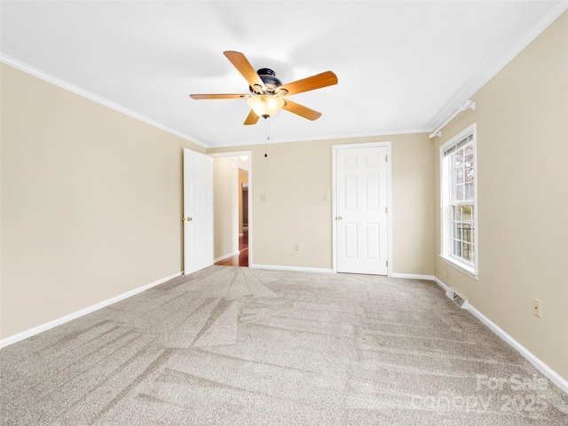 449 Riverwind Dr, Hendersonville, NC 28739 - interior space with carpet flooring, ornamental molding, baseboards, visible vents, and a ceiling fan