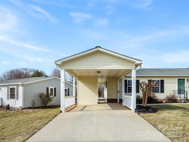 449 Riverwind Dr, Hendersonville, NC 28739 - view of front of property featuring a front yard, a carport, and concrete driveway