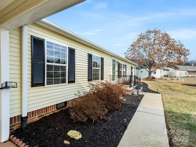 449 Riverwind Dr, Hendersonville, NC 28739 - view of property exterior with a lawn