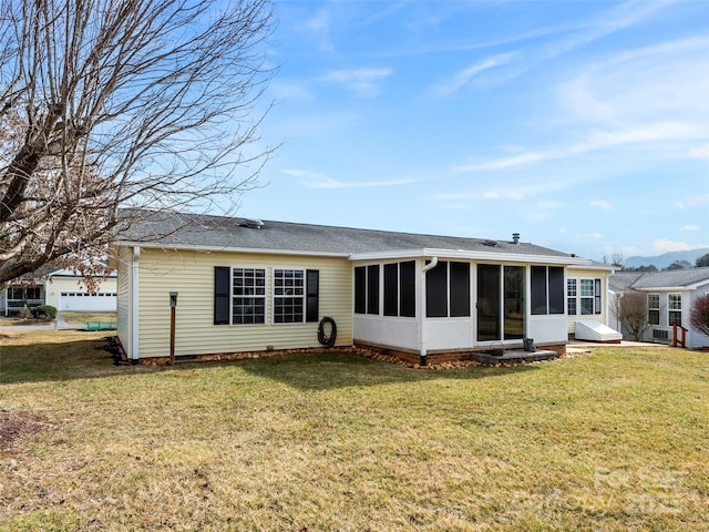 449 Riverwind Dr, Hendersonville, NC 28739 - rear view of house featuring a sunroom, roof with shingles, and a yard
