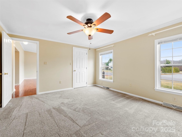 449 Riverwind Dr, Hendersonville, NC 28739 - unfurnished bedroom featuring baseboards, carpet, visible vents, and ornamental molding