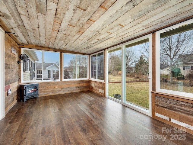 449 Riverwind Dr, Hendersonville, NC 28739 - unfurnished sunroom with wood ceiling, wood finished floors, a wood stove, and wooden walls