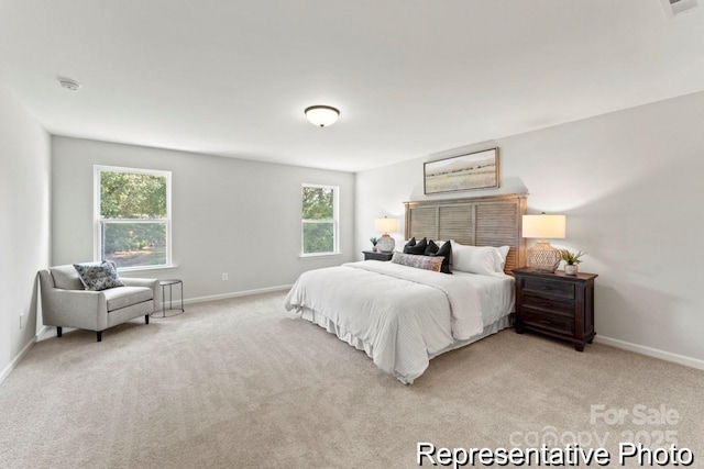 bedroom featuring light colored carpet