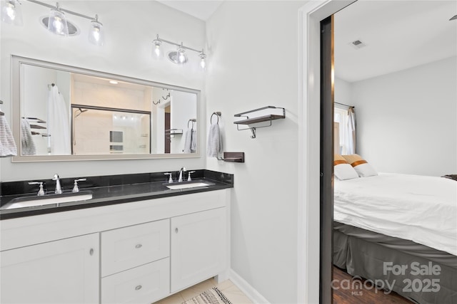 bathroom featuring vanity and a shower