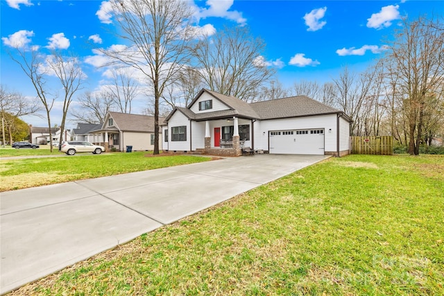 view of front of home with a garage and a front lawn