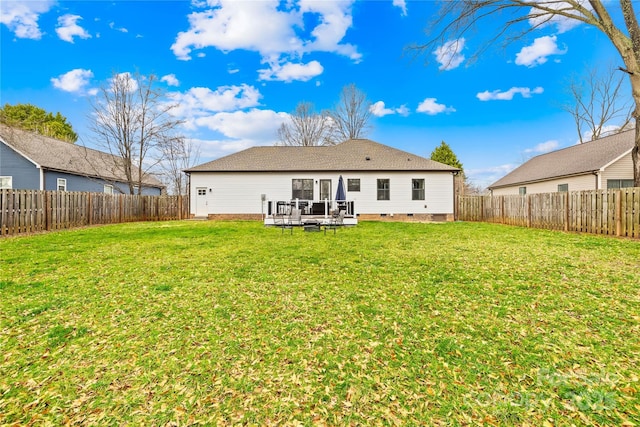 back of house with a yard and a deck