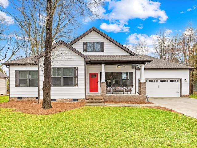 view of front of property with a garage and a front yard