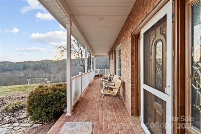 balcony with a porch and a mountain view