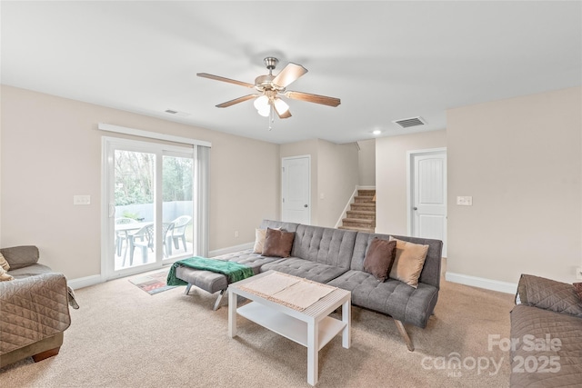 living room featuring light carpet and ceiling fan