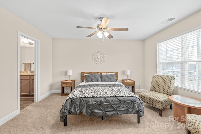 carpeted bedroom featuring ceiling fan, connected bathroom, and sink