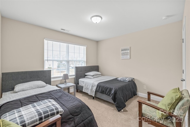 bedroom featuring light colored carpet