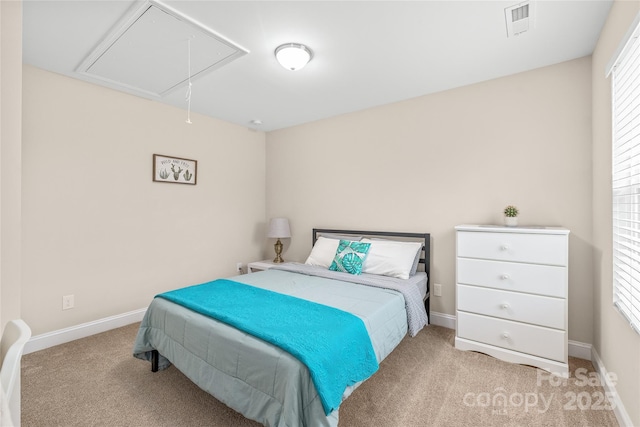 carpeted bedroom with multiple windows