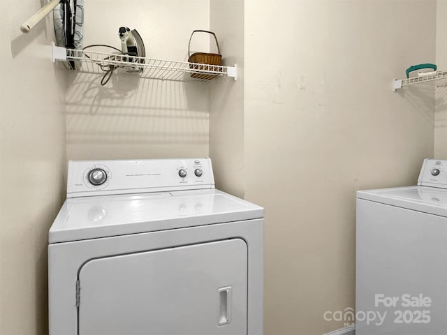 washroom with washer and clothes dryer