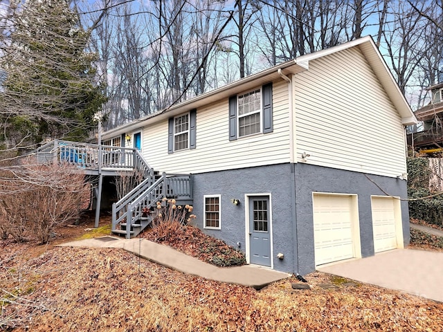 view of front of property with a garage and a deck