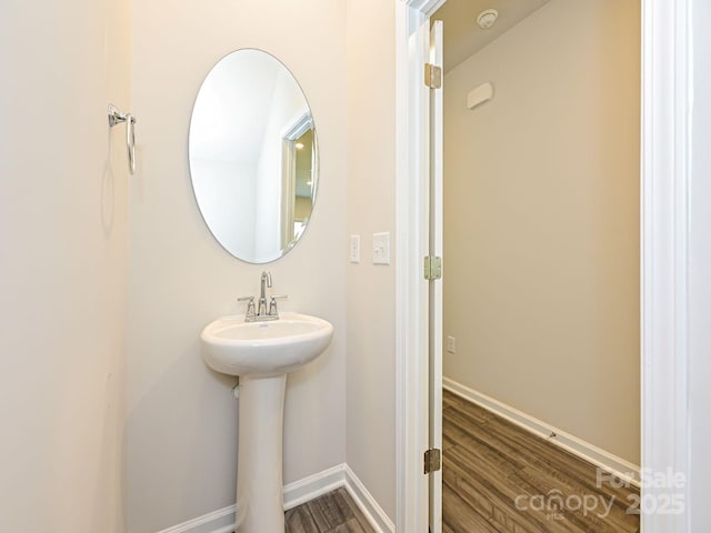 bathroom with hardwood / wood-style flooring