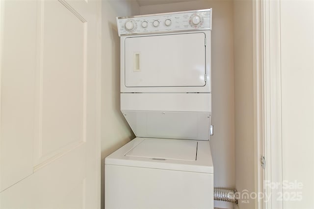 laundry area with laundry area and stacked washer and clothes dryer