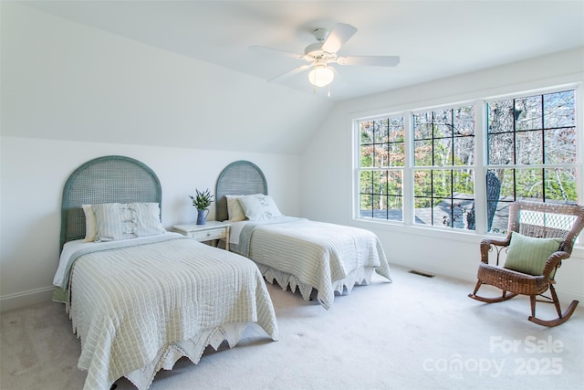 bedroom with baseboards, visible vents, vaulted ceiling, and light carpet