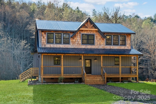 view of front facade featuring a front lawn and covered porch