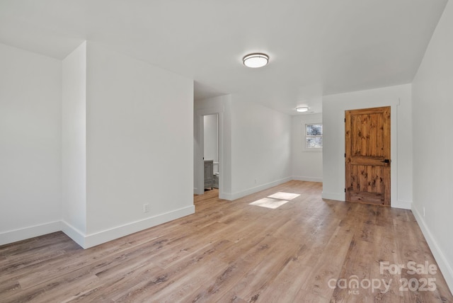 spare room with light hardwood / wood-style floors