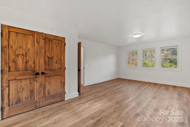 unfurnished room featuring light hardwood / wood-style floors