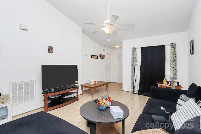 living room featuring ceiling fan and light wood-type flooring