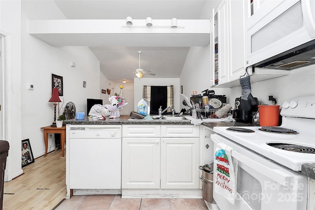 kitchen featuring sink, white cabinets, white appliances, and kitchen peninsula