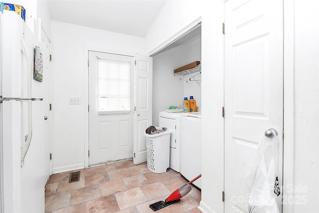 washroom featuring washing machine and dryer