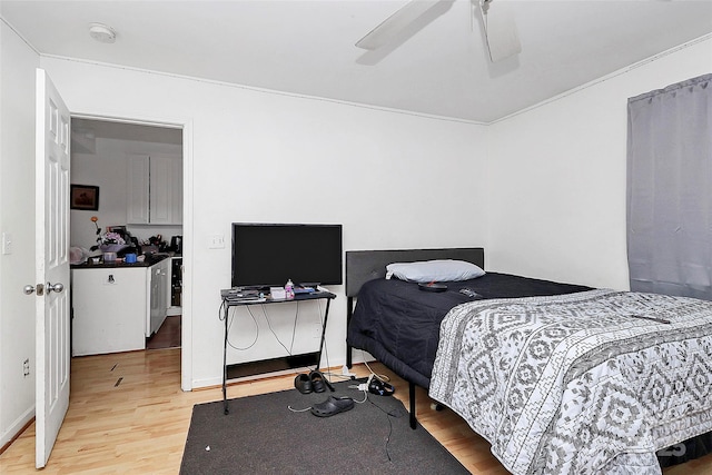 bedroom with ceiling fan and light wood-type flooring