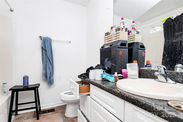 bathroom with vanity and toilet