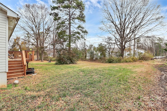 view of yard featuring a wooden deck