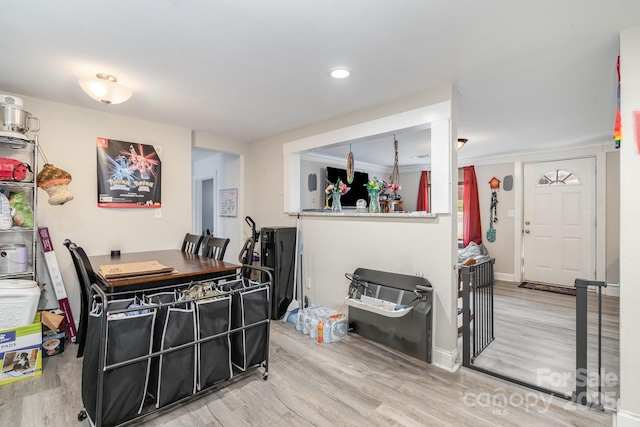 dining room featuring wood finished floors and baseboards