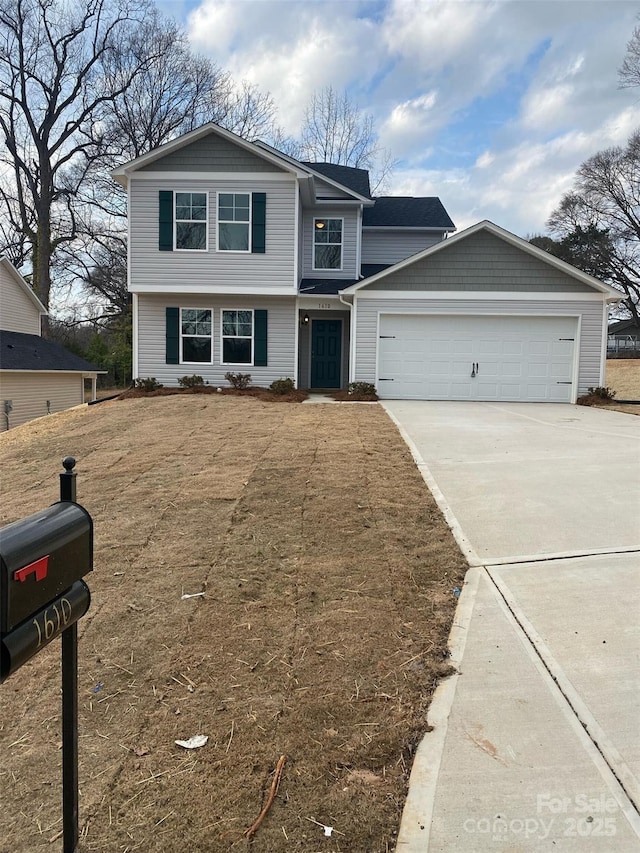 front of property with a garage