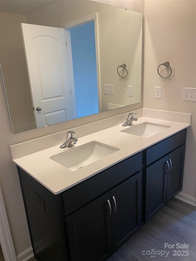 bathroom featuring vanity and hardwood / wood-style flooring