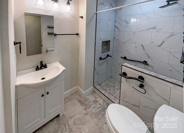 bathroom featuring vanity, tiled shower, and toilet